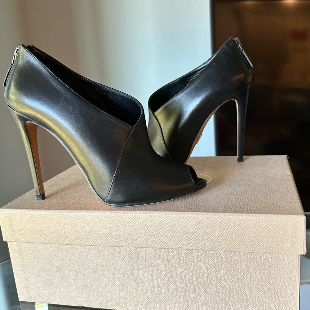 Prada peep toes bootie , leather. Black color.
